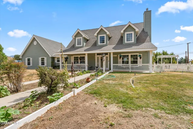a front view of a house with a swimming pool