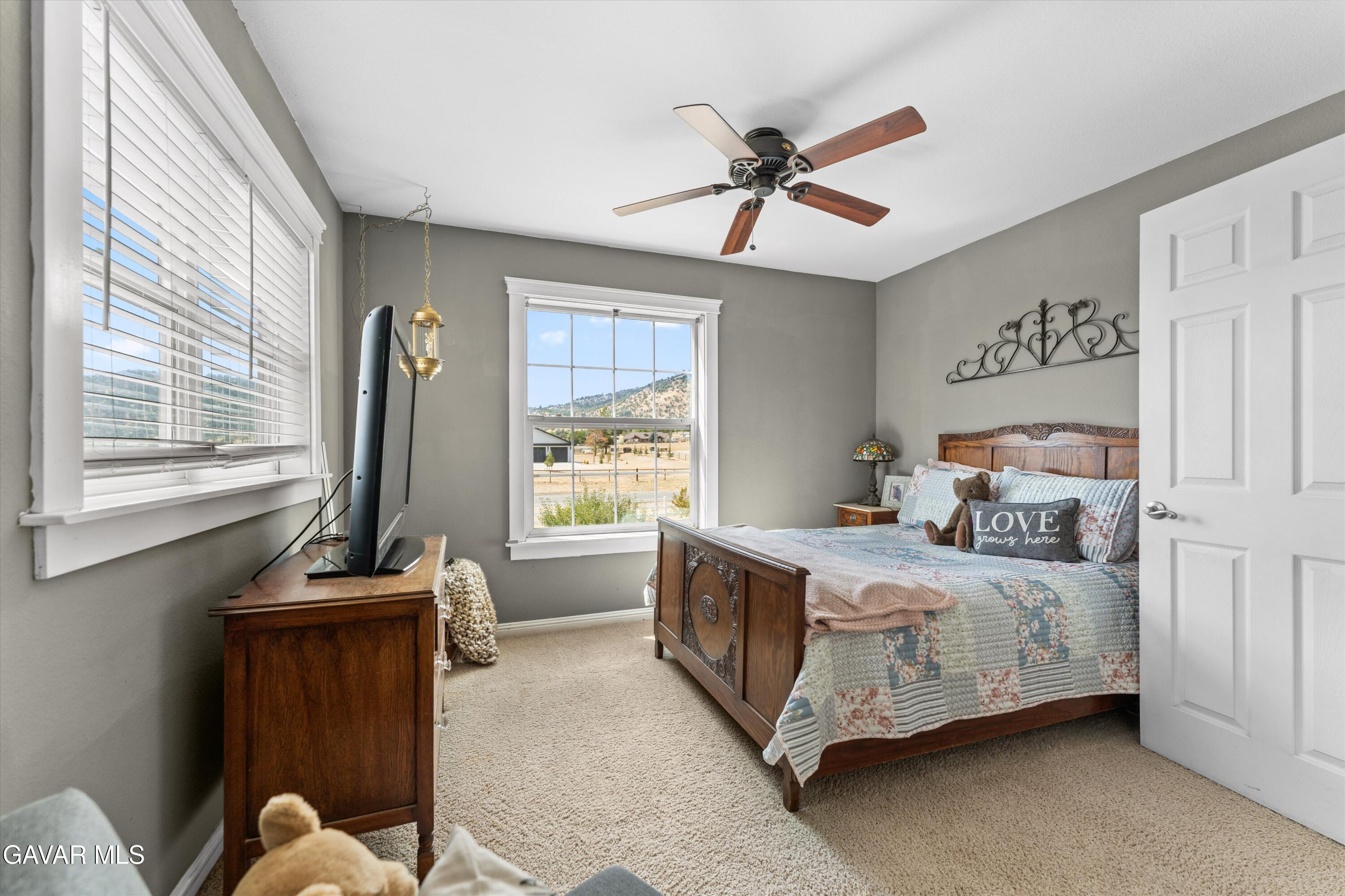 27450 Harness Drive Tehachapi, CA 93561 - Photo 43 of 44 a bedroom with a bed and a window