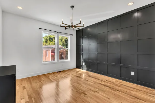 a bathroom with a window and a shower