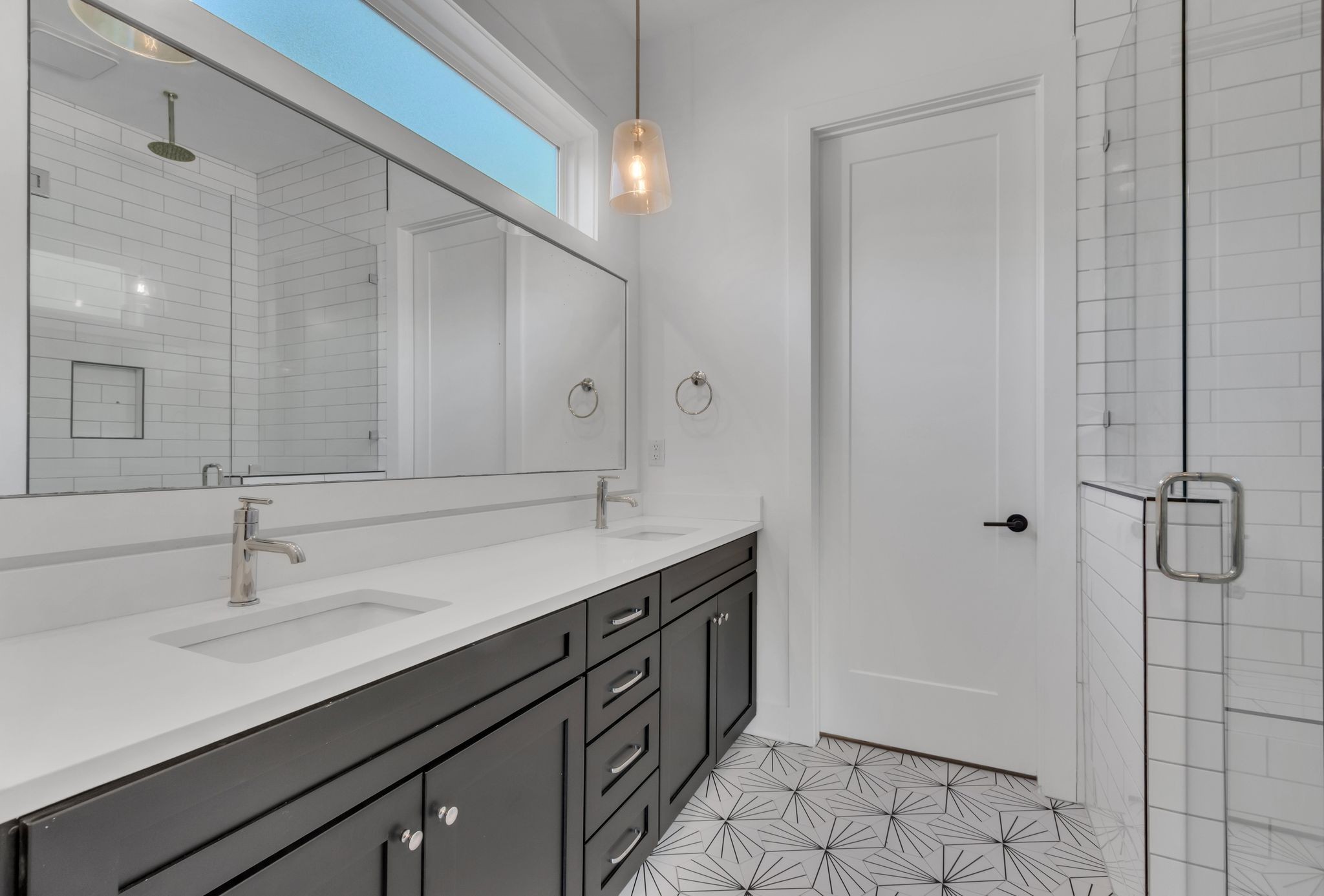 916 Green Street Franklin, TN 37064 - Photo 15 of 32 a bathroom with a double vanity sink a mirror and a shower