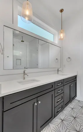 a sink with a mirror and cabinets