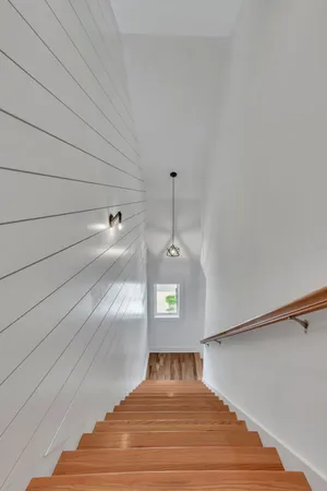 a bedroom with a bed and a ceiling fan