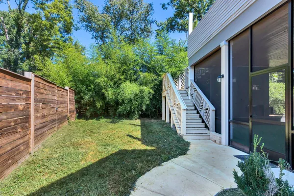 a backyard of a house with lots of green space