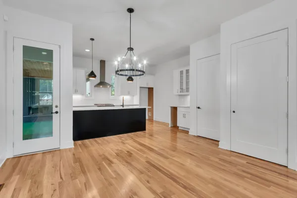 a view of kitchen with sink and window