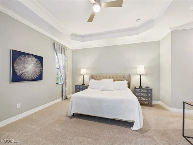 a bedroom with a bed and a lamp