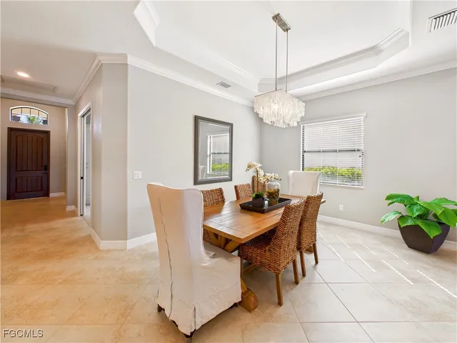 a view of a dining room with furniture and window