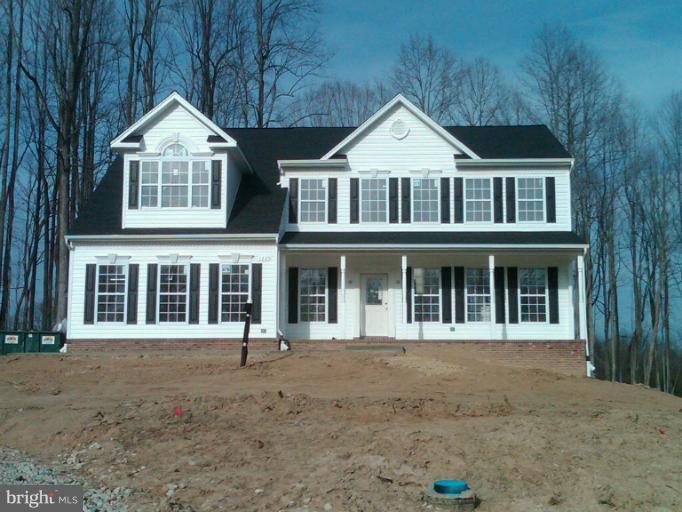3215 Saber Road Huntingtown, MD 20639 - Photo 1 of 1 a front view of a house with a yard