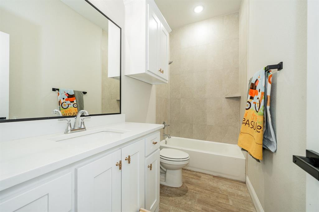 2000 Sweet Springs Road Weatherford, TX 76088 - Photo 24 of 40 a bathroom with a sink a toilet and shower
