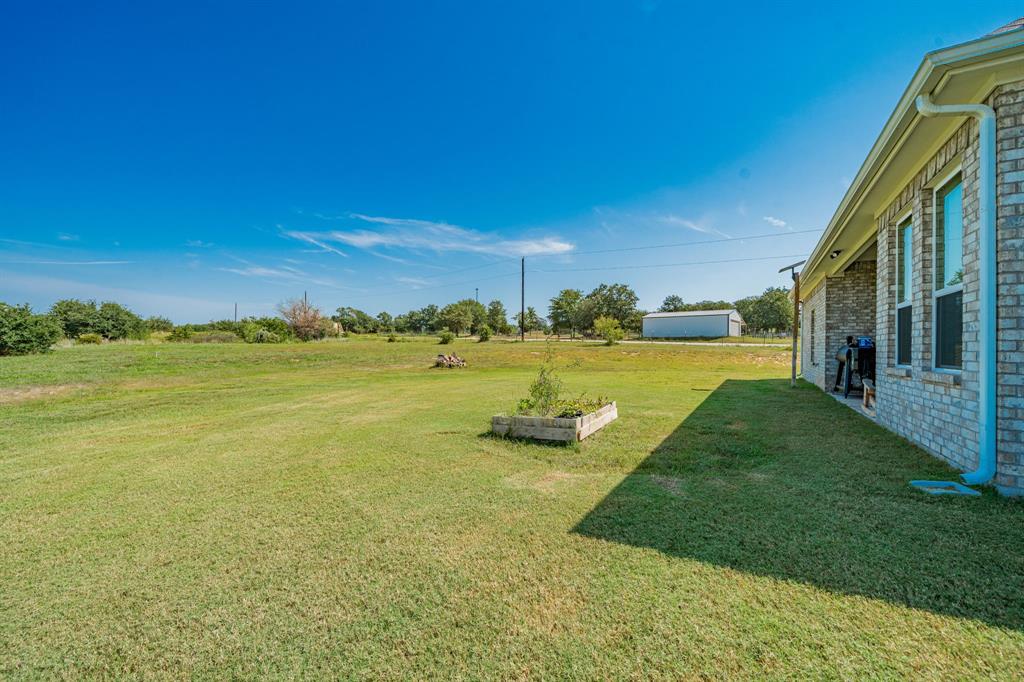 2000 Sweet Springs Road Weatherford, TX 76088 - Photo 37 of 40 a view of a lake with a big yard