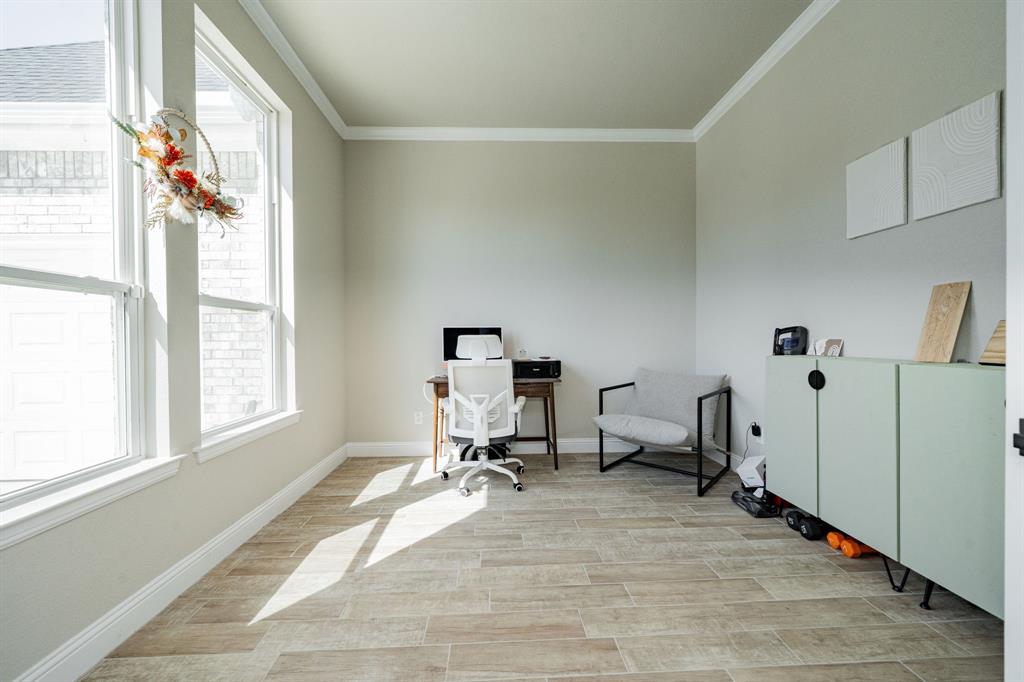 2000 Sweet Springs Road Weatherford, TX 76088 - Photo 4 of 40 a view of a workspace with furniture and a window