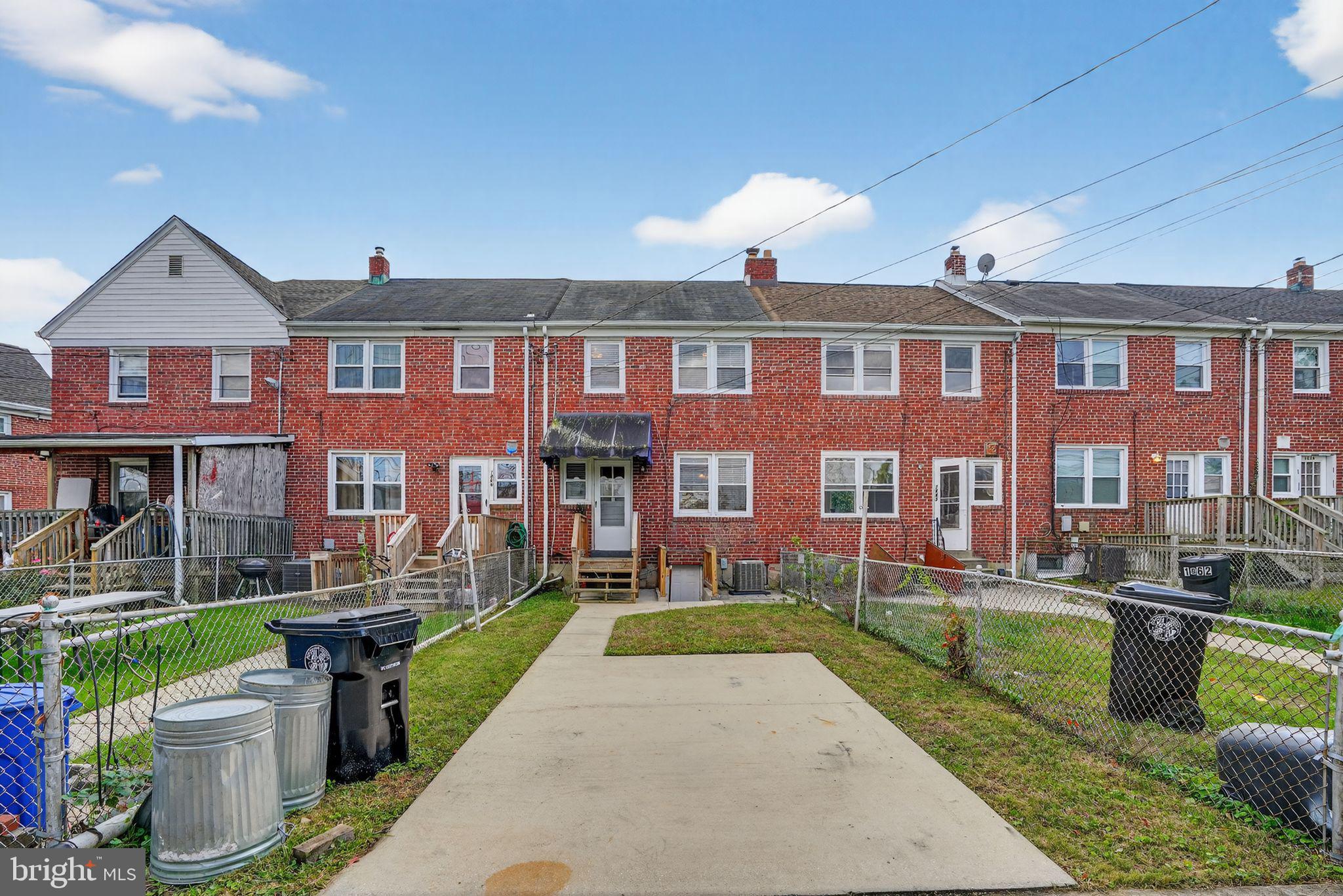 1864 Yakona Road Parkville, MD 21234 - Photo 23 of 24 a front view of a house with a yard table and chairs