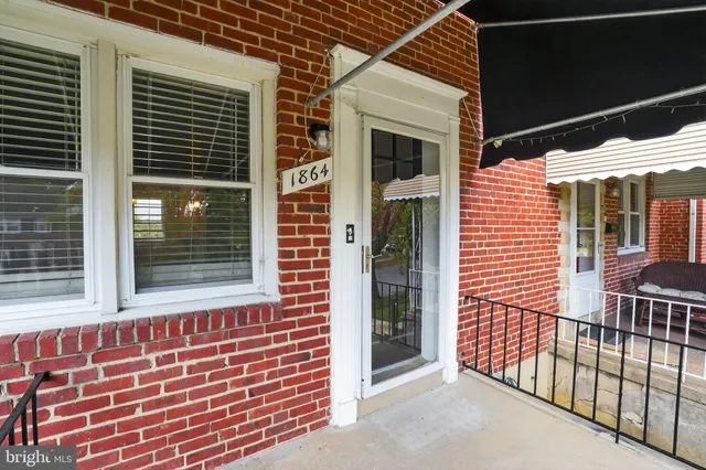 a view of a brick house with a window