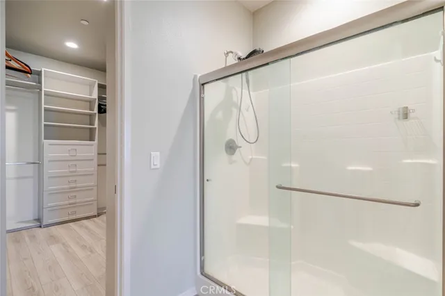 a bathroom with a glass shower door