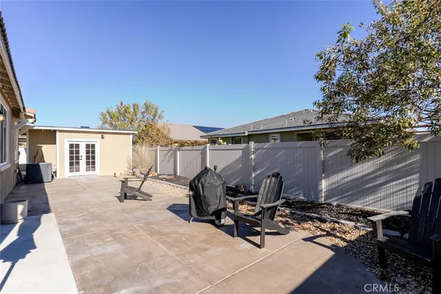 a view of a backyard with chair and couch