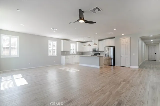 a view of kitchen with wooden floor and window