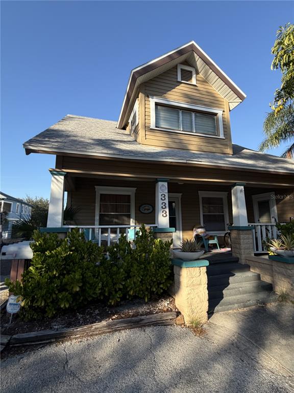 333 9th Avenue North, Unit B St. Petersburg, FL 33701 - Photo 7 of 8 a front view of a house with garage