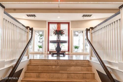 9049 Players Drive Weeki Wachee, FL 34613 - Photo 40 of 43 a view of staircase with large window