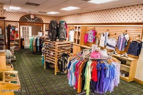 9049 Players Drive Weeki Wachee, FL 34613 - Photo 43 of 43 a view of walk in closet with clothes