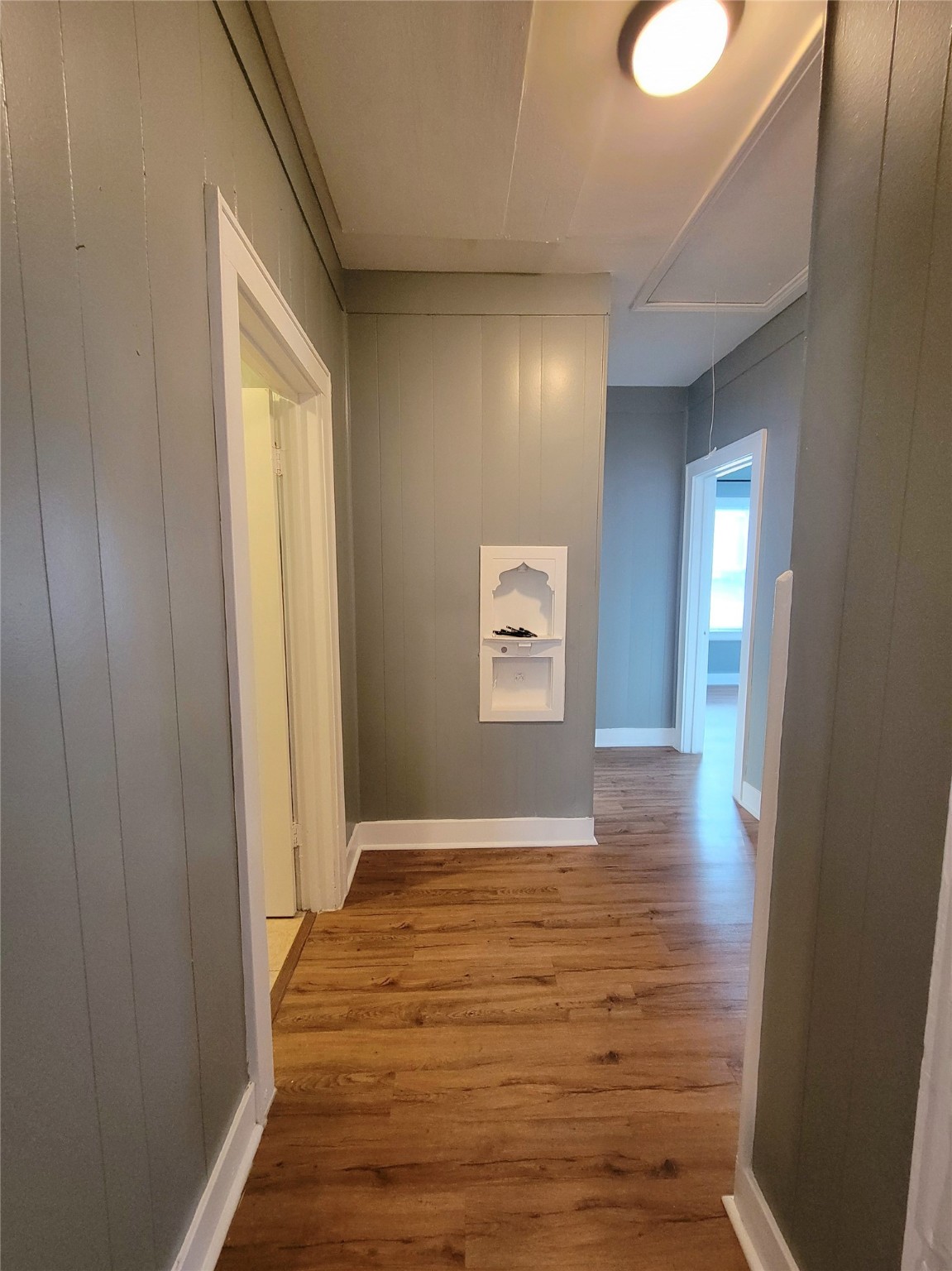 2811 Chenevert Street Houston, TX 77004 - Photo 16 of 26 a view of an empty room with wooden floor and a window