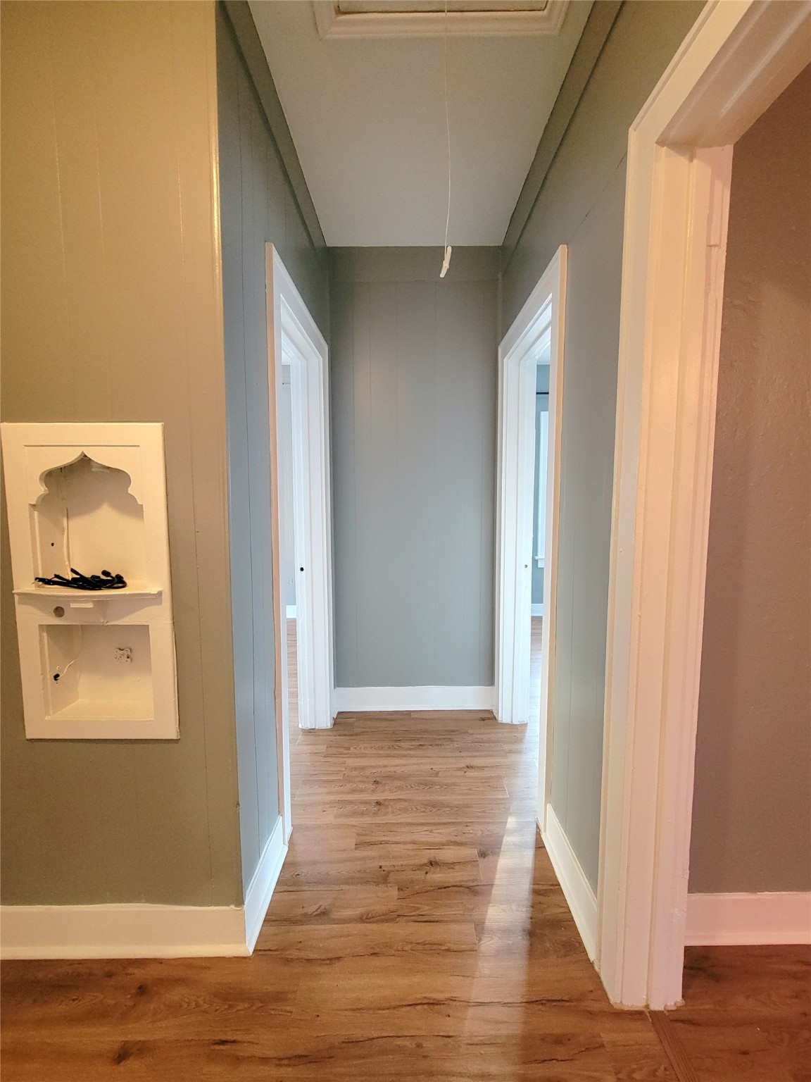2811 Chenevert Street Houston, TX 77004 - Photo 19 of 26 a view of a hallway with wooden floor