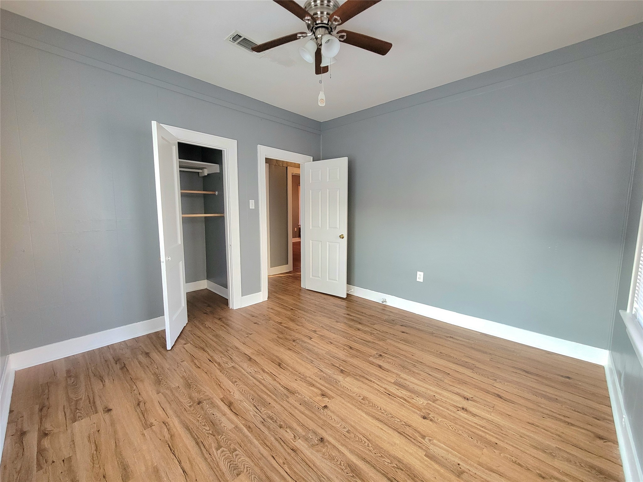 2811 Chenevert Street Houston, TX 77004 - Photo 23 of 26 wooden floor in an empty room with a window