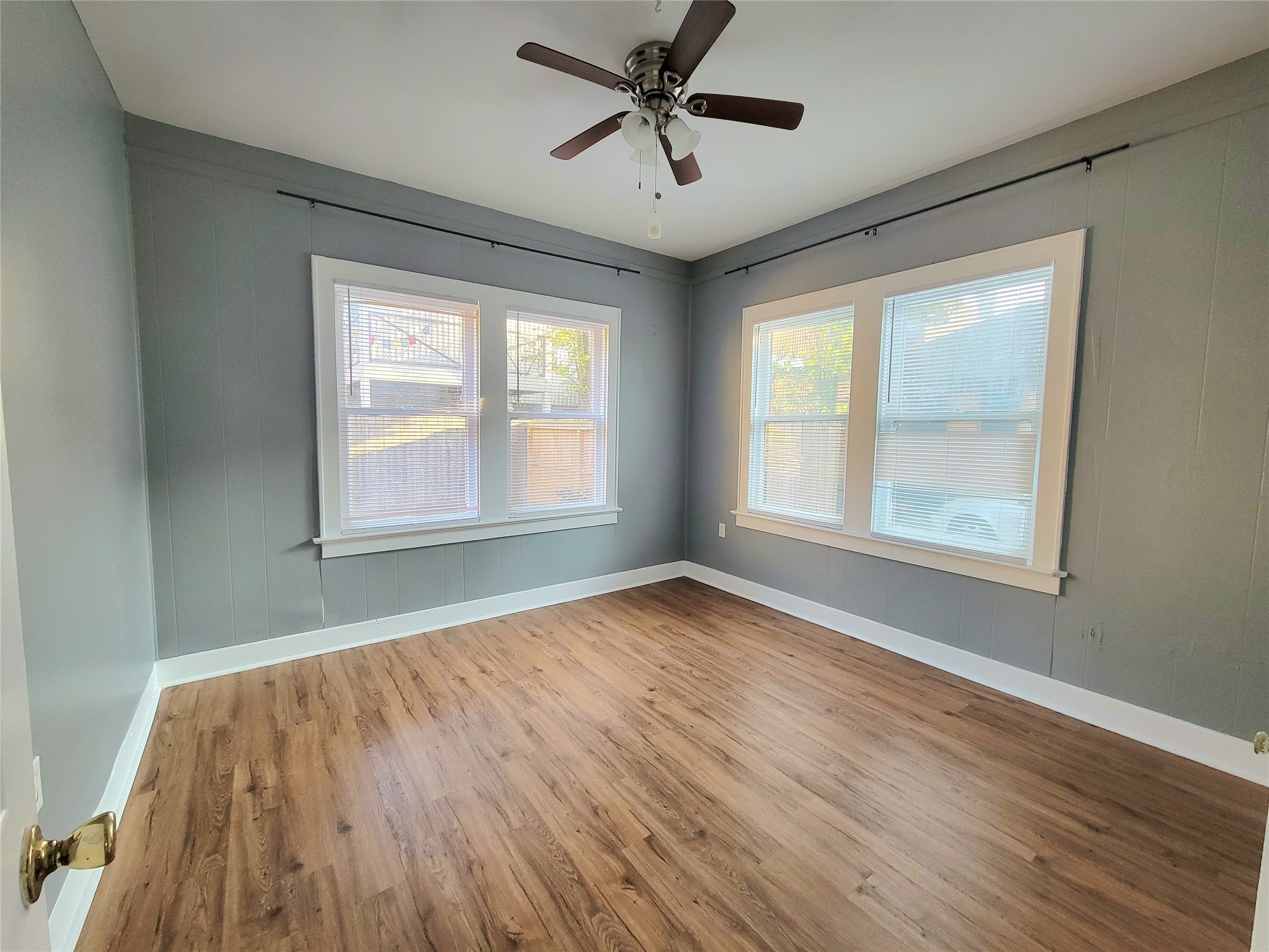 2811 Chenevert Street Houston, TX 77004 - Photo 24 of 26 a view of empty room with wooden floor and fan