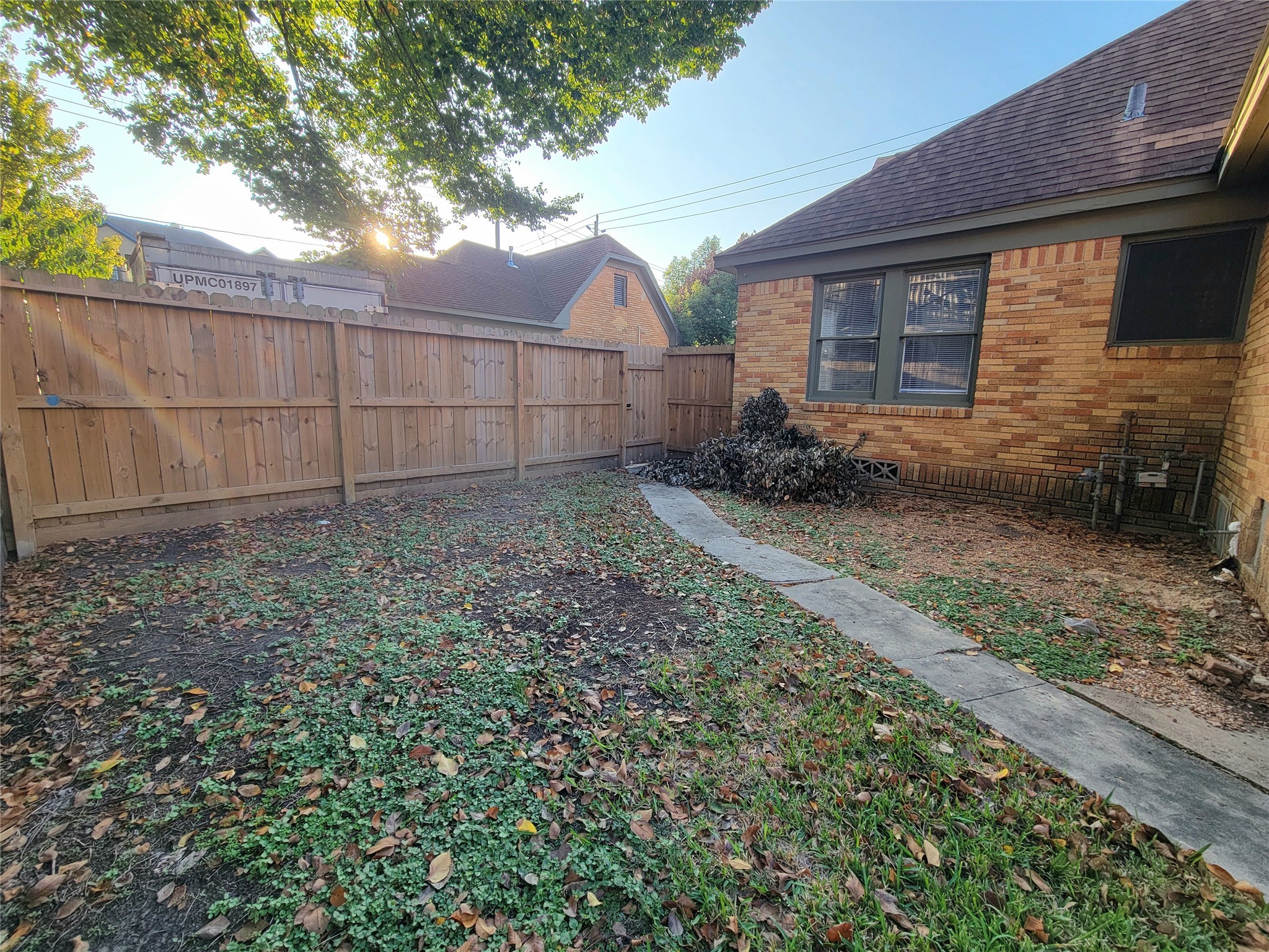 2811 Chenevert Street Houston, TX 77004 - Photo 26 of 26 a backyard of a house with lots of green space