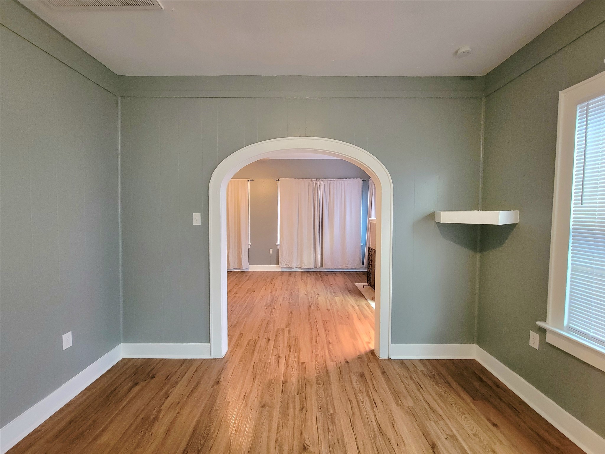 2811 Chenevert Street Houston, TX 77004 - Photo 9 of 26 a view of empty room with wooden floor and fan