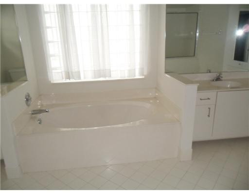 6361 Brava Way Boca Raton, FL 33433 - Photo 8 of 13 a bathroom with a bathtub and a sink