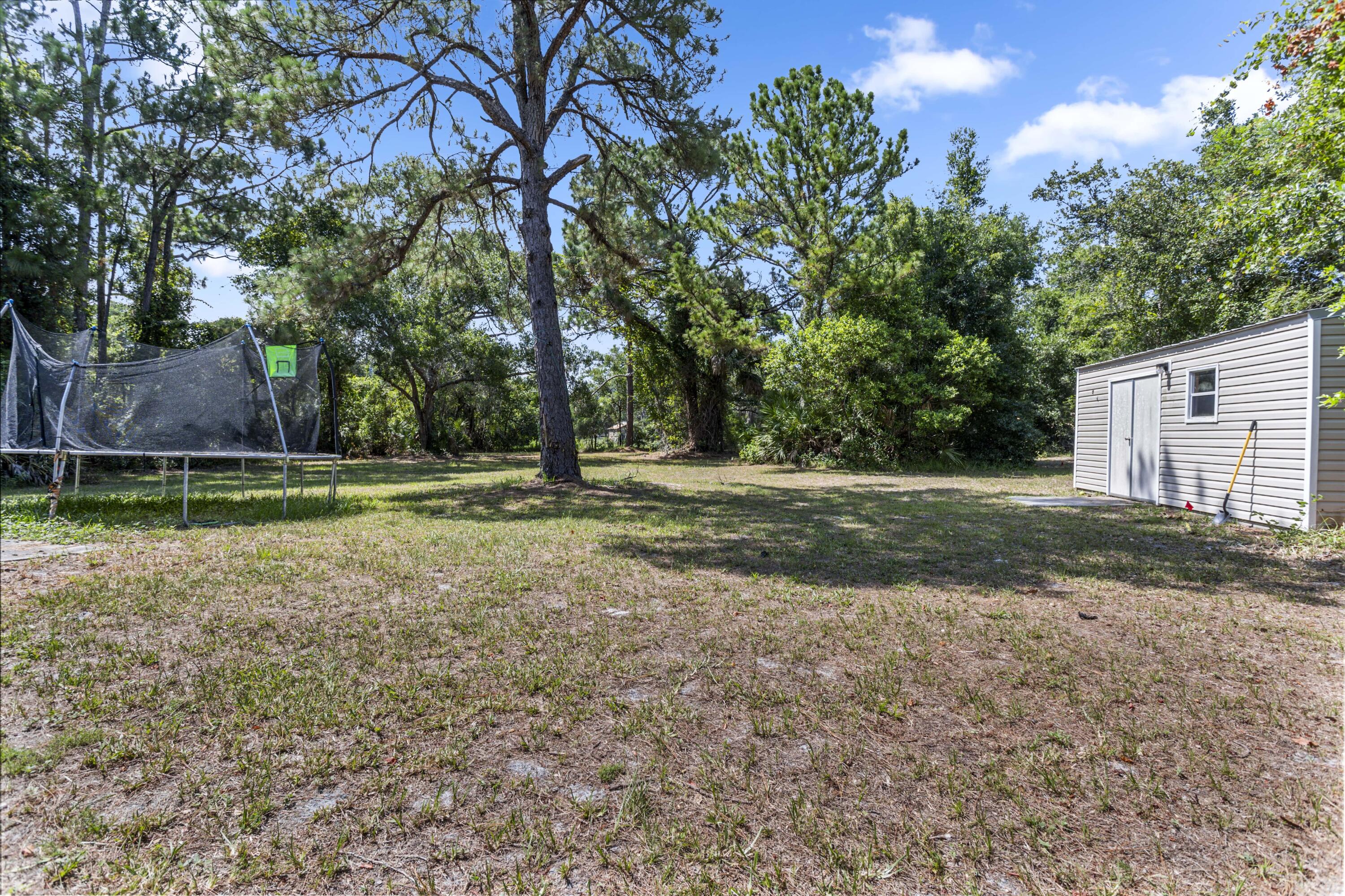 4152 Fairfax Drive Mims, FL 32754 - Photo 40 of 45 Backyard with large shed