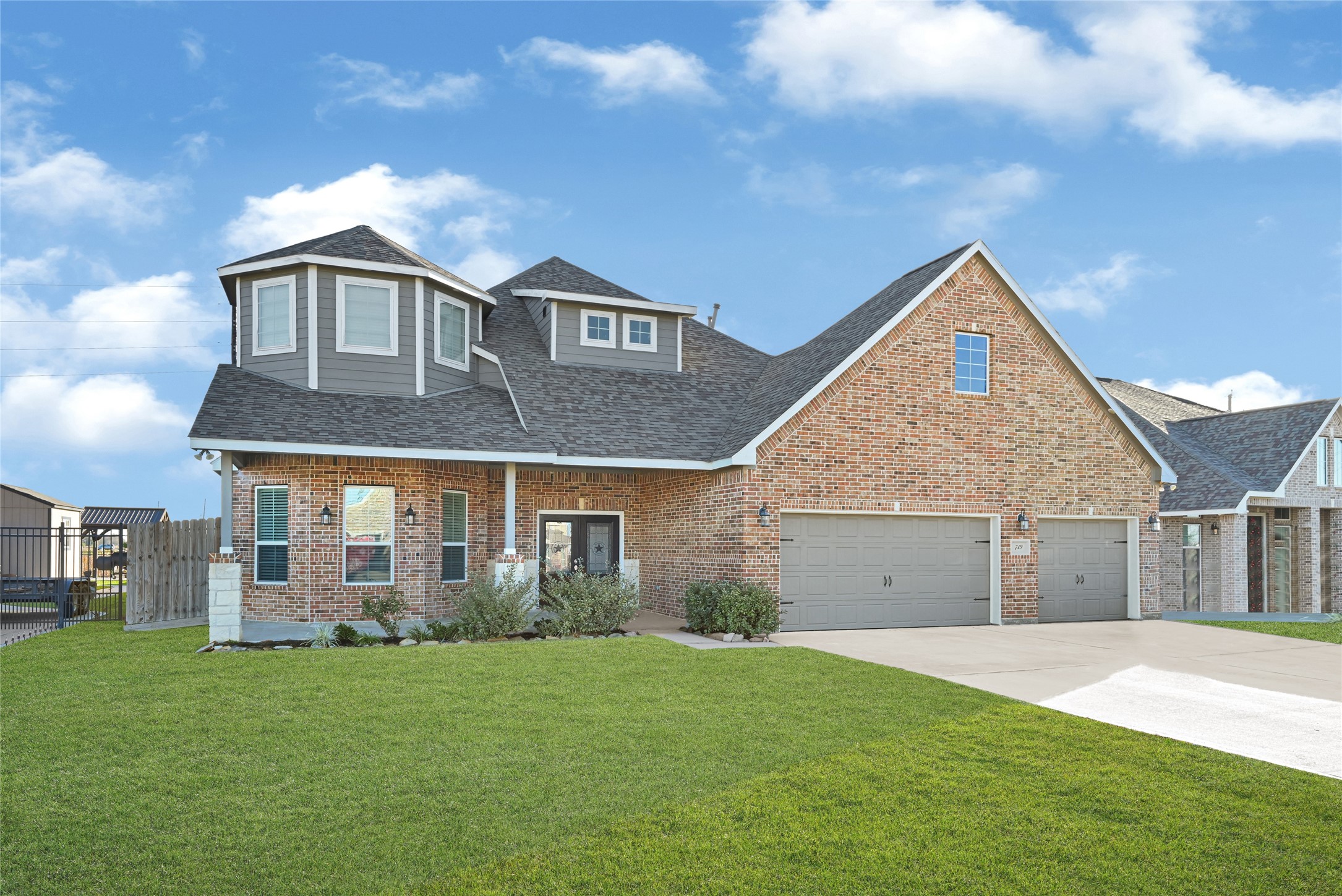 a front view of a house with a garden
