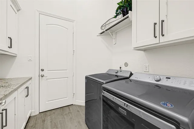 a view of a kitchen with appliances