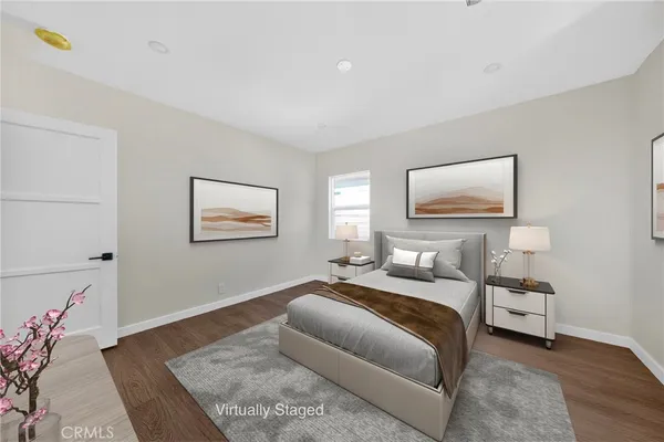 a bedroom with a bed and a couch