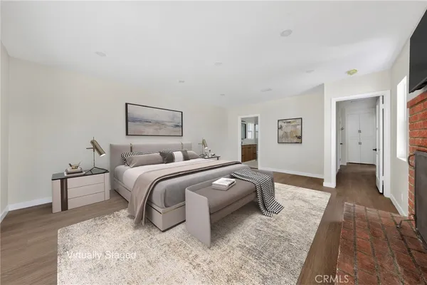 a bedroom with a bed and a couch