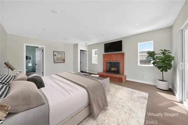 a spacious bedroom with a bed and a couch