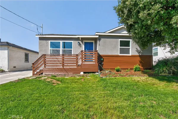 front view of a house with a yard