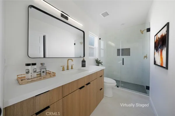a bathroom with a double vanity sink and mirror