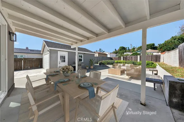 a outdoor space with lots of tables a garden view and chairs