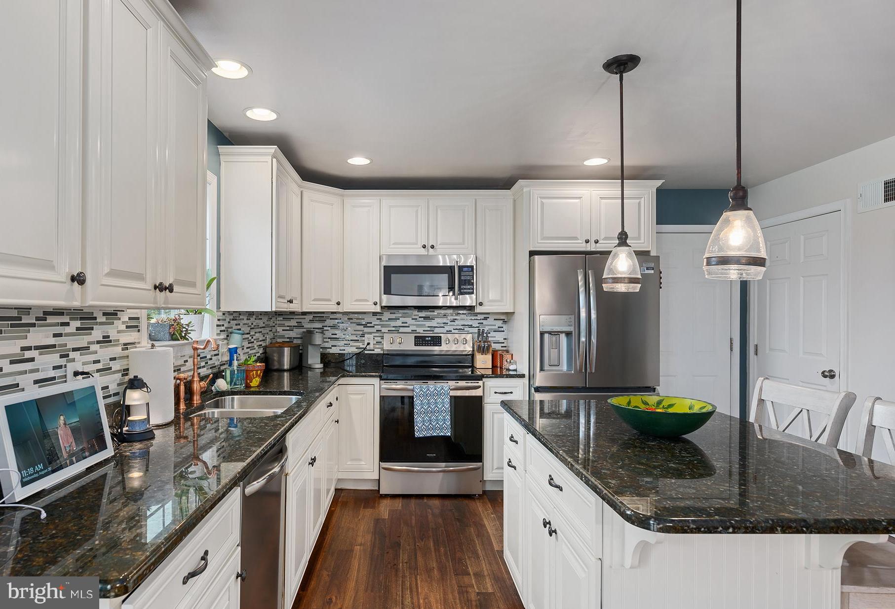 2 Anthony Court Peach Bottom, PA 17563 - Photo 11 of 42 a kitchen with stainless steel appliances granite countertop a sink a stove and a refrigerator