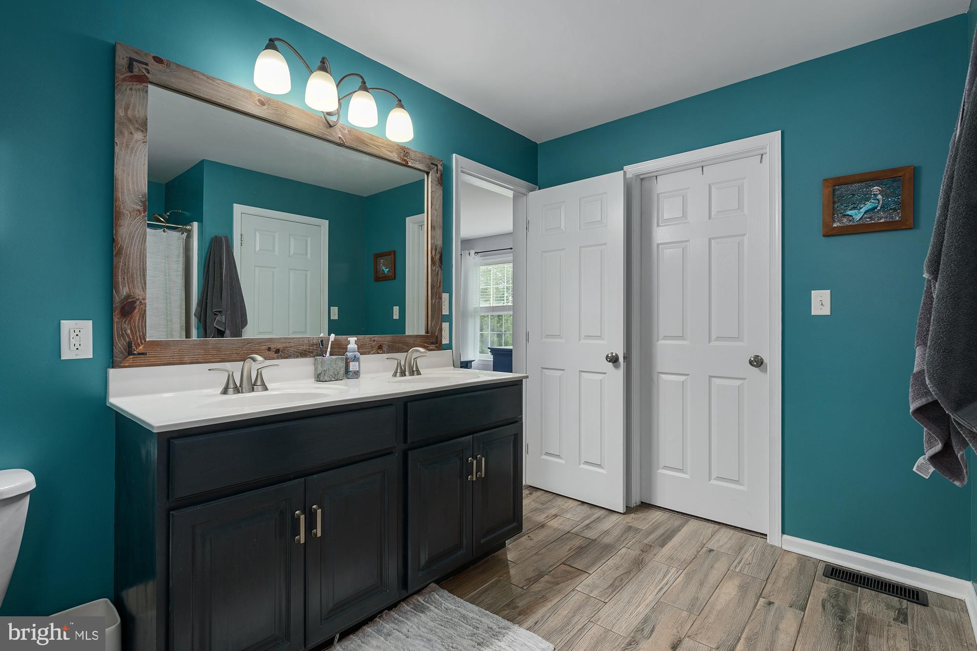 2 Anthony Court Peach Bottom, PA 17563 - Photo 20 of 42 a bathroom with a double vanity sink and a mirror