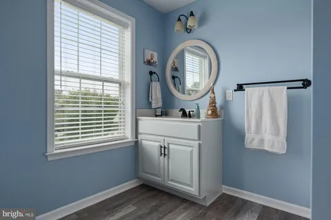 a room with a window and a mirror