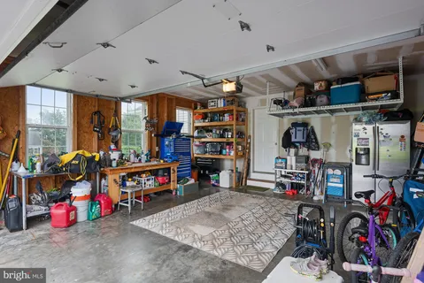 a view of a chairs and table on the wooden floor