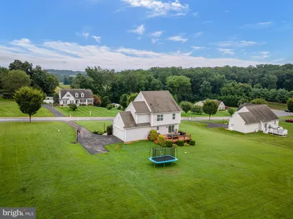 a aerial view of a garden with lawn chairs