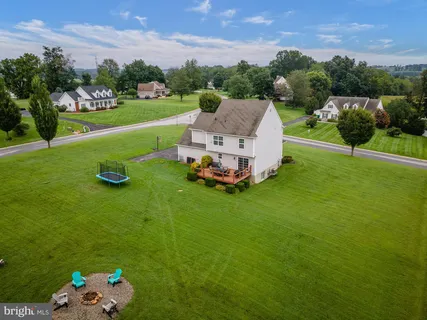 a aerial view of a house with pool