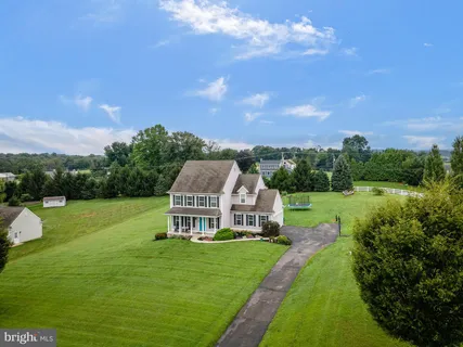 a view of a house with a big yard