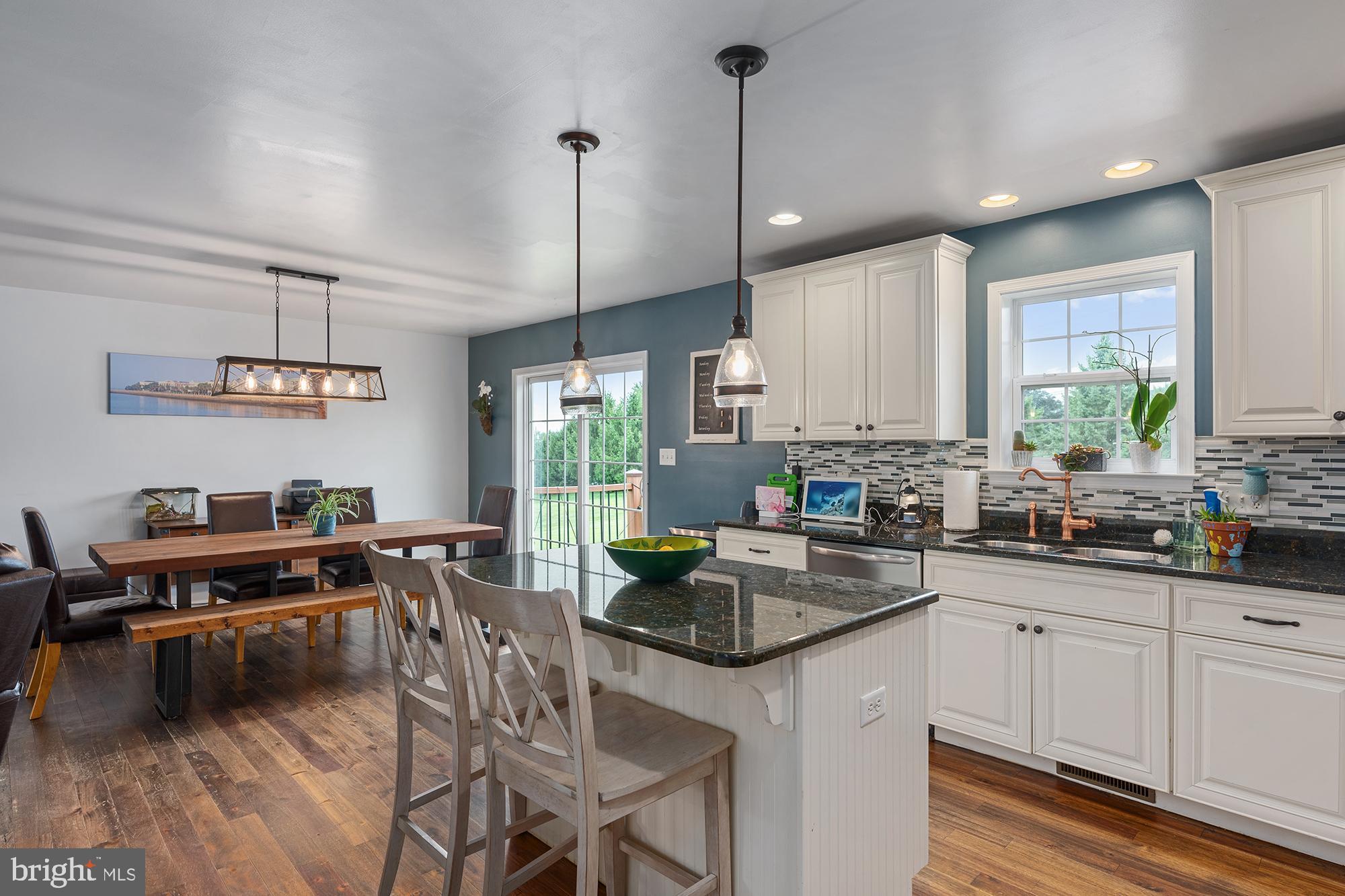 2 Anthony Court Peach Bottom, PA 17563 - Photo 10 of 42 a kitchen with kitchen island granite countertop a sink a counter space appliances and cabinets