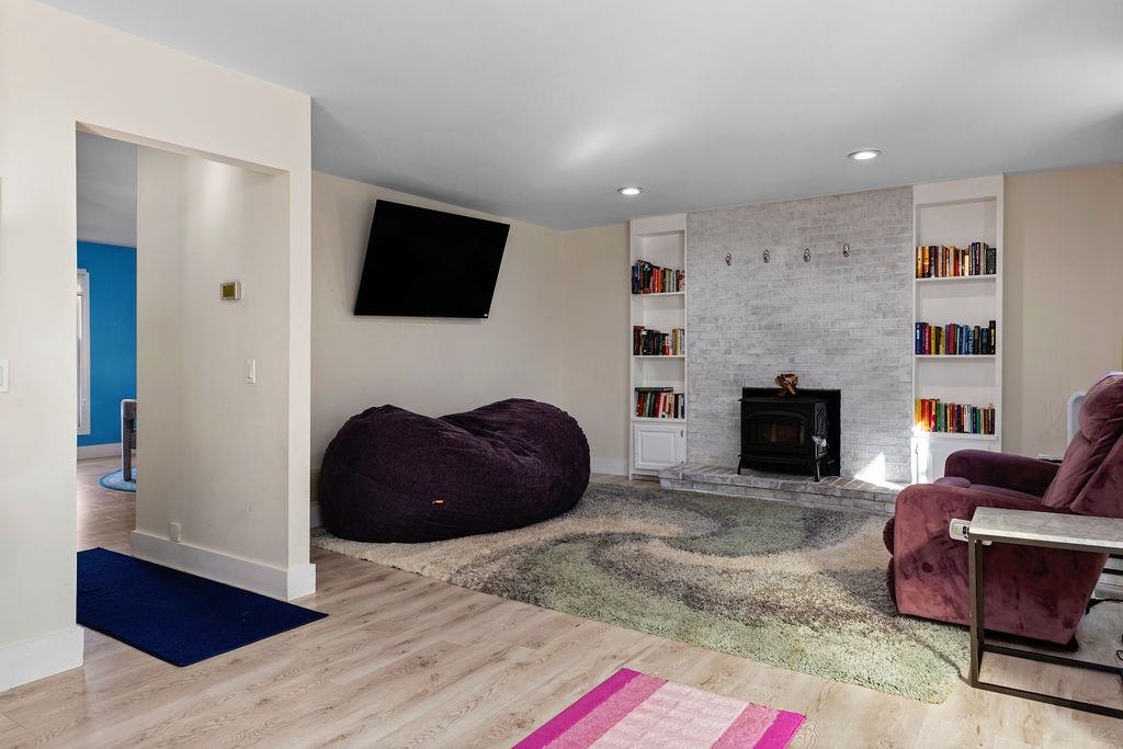 1368 Bluewater Road Harrisonburg, VA 22801 - Photo 13 of 52 a living room with furniture a fireplace and a flat screen tv