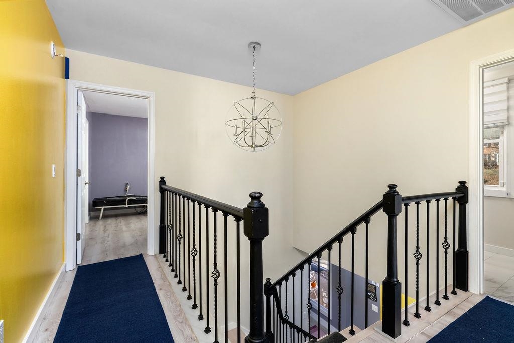 1368 Bluewater Road Harrisonburg, VA 22801 - Photo 18 of 52 a view of a hallway with wooden floor and a bathroom