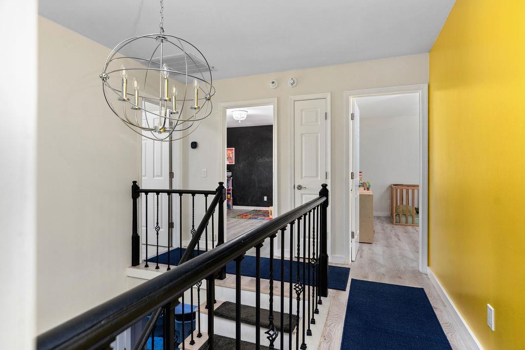 1368 Bluewater Road Harrisonburg, VA 22801 - Photo 19 of 52 a view of staircase with railing and a chandelier