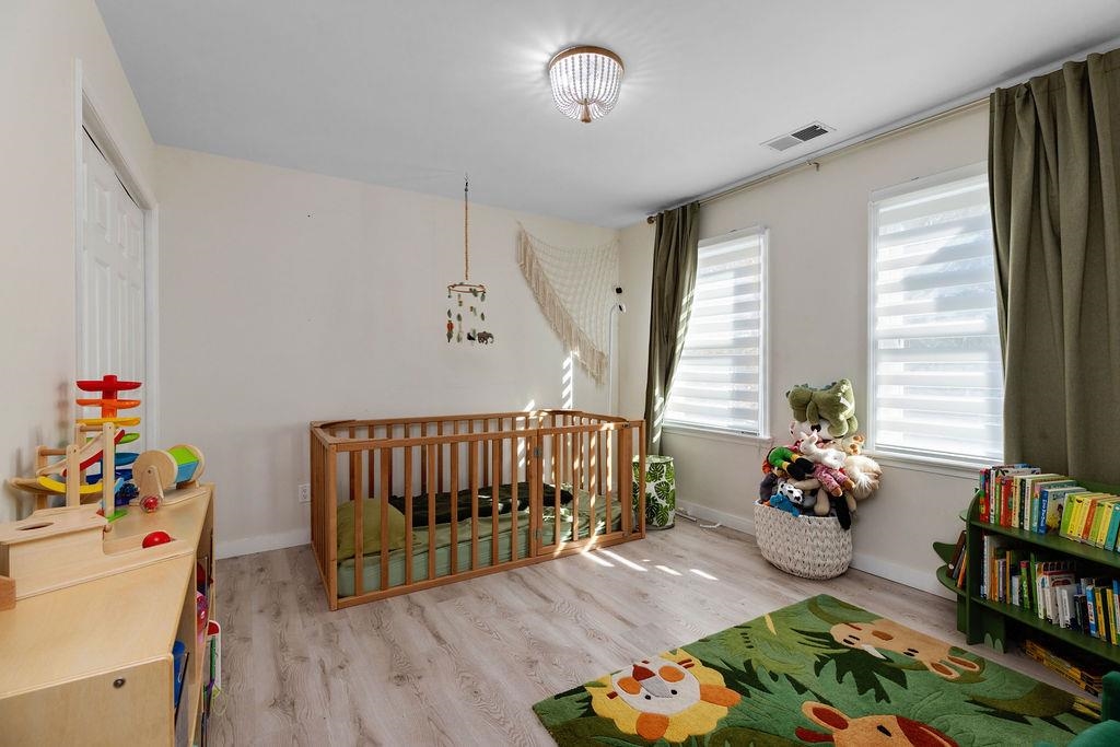 1368 Bluewater Road Harrisonburg, VA 22801 - Photo 29 of 52 a living room with baby crib furniture and a window